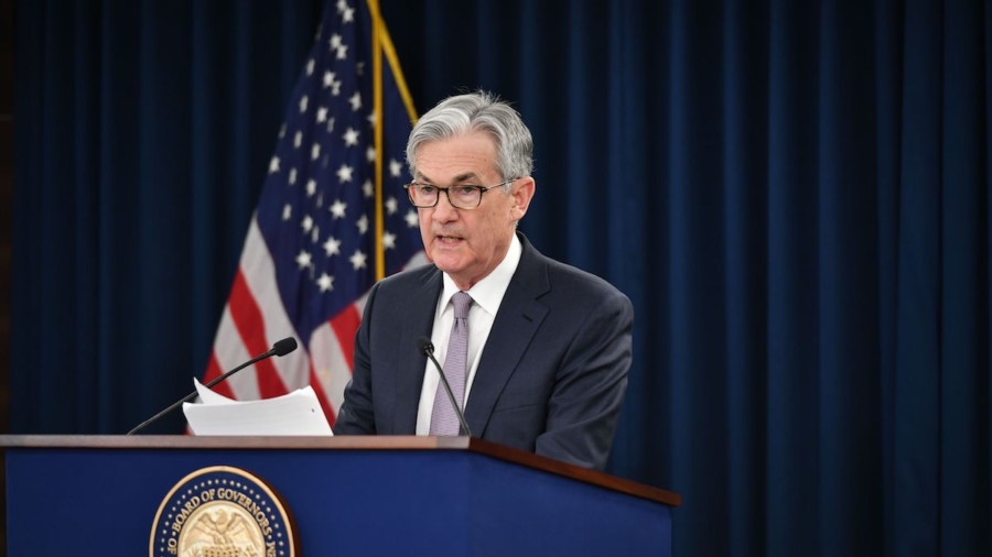 The Fed Holds Interest Rates Near Zero, Raises Economic Outlook