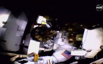 Astronaut Completes Spacewalk Without Helmet Camera, Lights