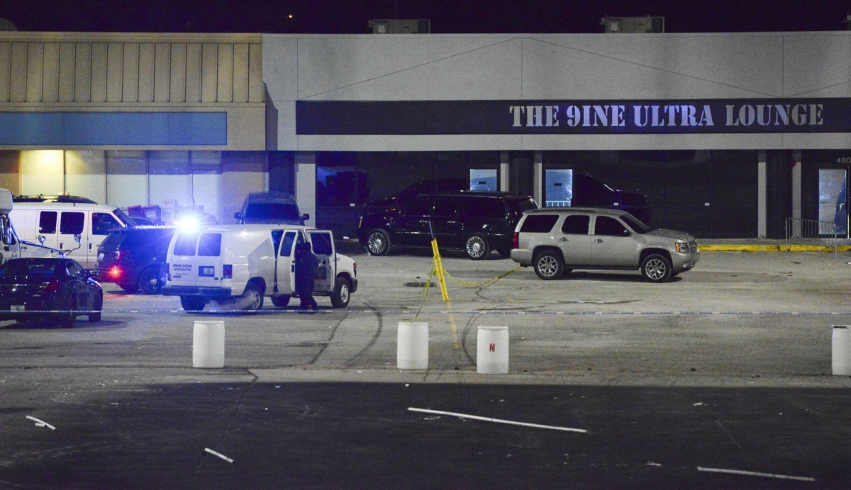 Kansas City, Mo., police crime scene investigators gather evidence at the scene of a shooting at a nightclub in Kansas City, Mo., in the early hours of Jan. 20, 2020. (Luke Nozicka/The Kansas City Star via AP)