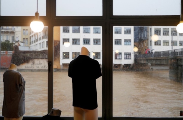 Mannequins are seen inside a shop at the Onyar river during the storm "Gloria" in Girona, Spainon Jan. 22, 2020. (Nacho Doce/Reuters)