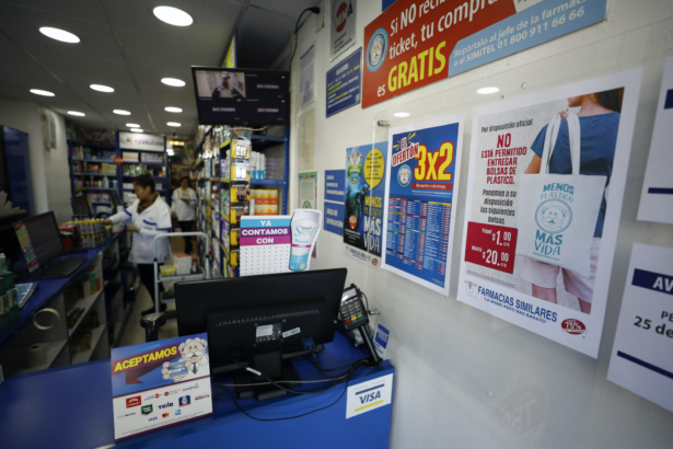 A sign posted at a pharmacy reads, in Spanish, "By official order, it is not permitted to provide plastic bags. We are offering the following bags: Paper, 1 peso [around 5 cents], cotton, 20 pesos [around $1]," in central Mexico City, Wednesday, Jan. 1, 2020. (Rebecca Blackwell/AP)