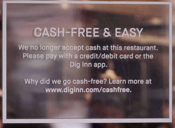 A sign on the door of a business that only accepts credit cards for payment in Manhattan, New York City on Jan. 24, 2020. (Christian Watjen/NTD)