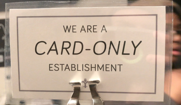 A sign is shown inside of a card-only establishment in Manhattan, New York City on Jan. 24, 2020. (Christian Watjen/NTD)
