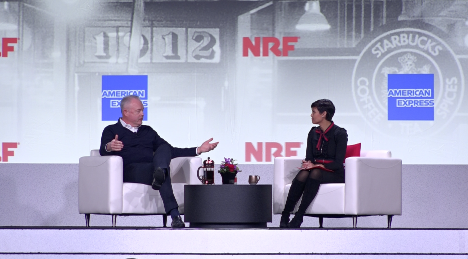 Starbucks CEO Kevin Johnson and host talk at the National Retail Federation Big Show in New York City on Jan. 13, 2020. (Don Tran/NTD)