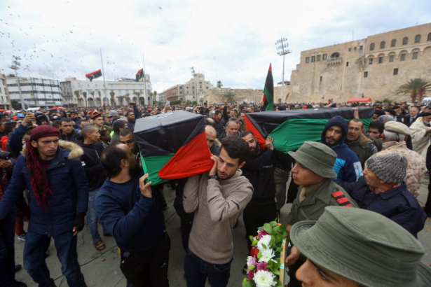 Libyan mourners carry the coffin of army cadets who were killed in an airstrike on a military school, during their funeral in the Martyrs Square of Libya's capital Tripoli on Jan. 5, 2020. (Mahmud Turkia/AFP via Getty Images)