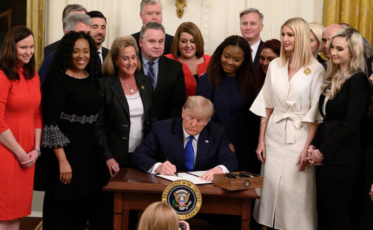 President Donald Trump signs an executive order on combating human trafficking in the East Room of the White House in Washington, on Jan. 31, 2020. (Andrew Caballero-Reynolds/AFP via Getty Images)