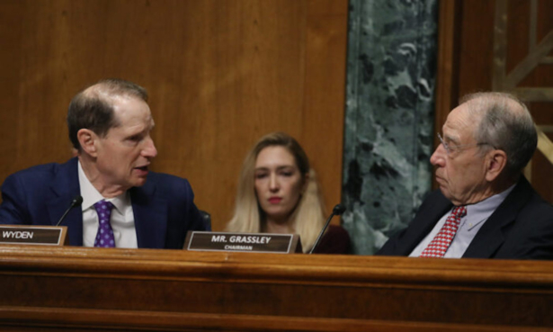 Sen. Ron Wyden (D-Ore.) (L), talks with Chairman Chuck Grassley (R-Iowa) during a Senate Finance Committee committee hearing on Capitol Hill, in Washington on Oct. 24, 2019. (Mark Wilson/Getty Images)