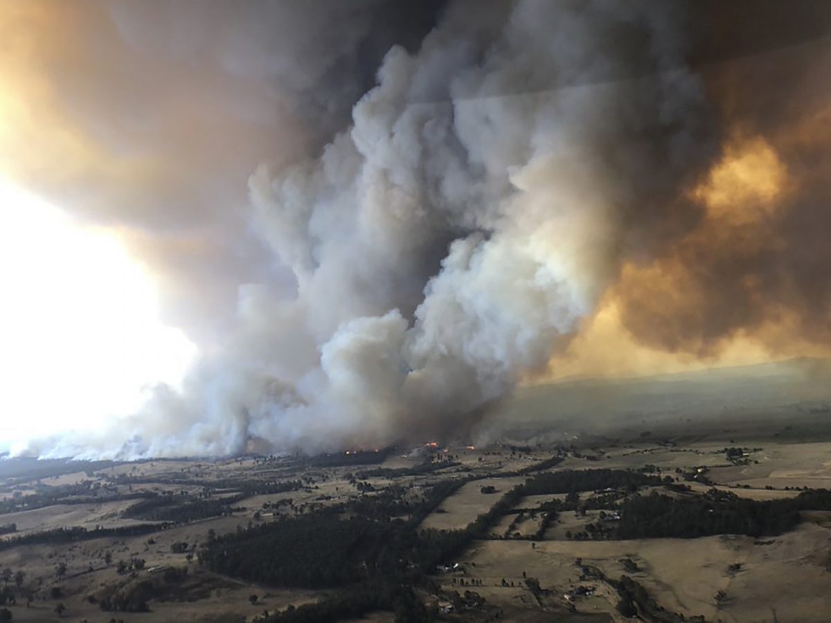 wildfires rage under plumes of smoke in Bairnsdale, Australia. on Dec. 30, 2019. (Glen Morey via AP)