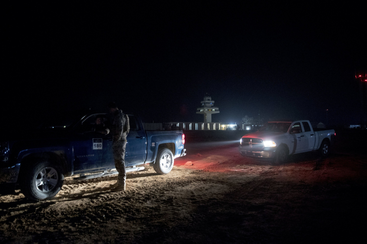 Members of the military wait outside facilities where President Donald Trump and First Lady Melania Trump are visiting at Al Assad Air Base, Iraq, on Dec. 26, 2018. (Andrew Harnik/AP Photo)