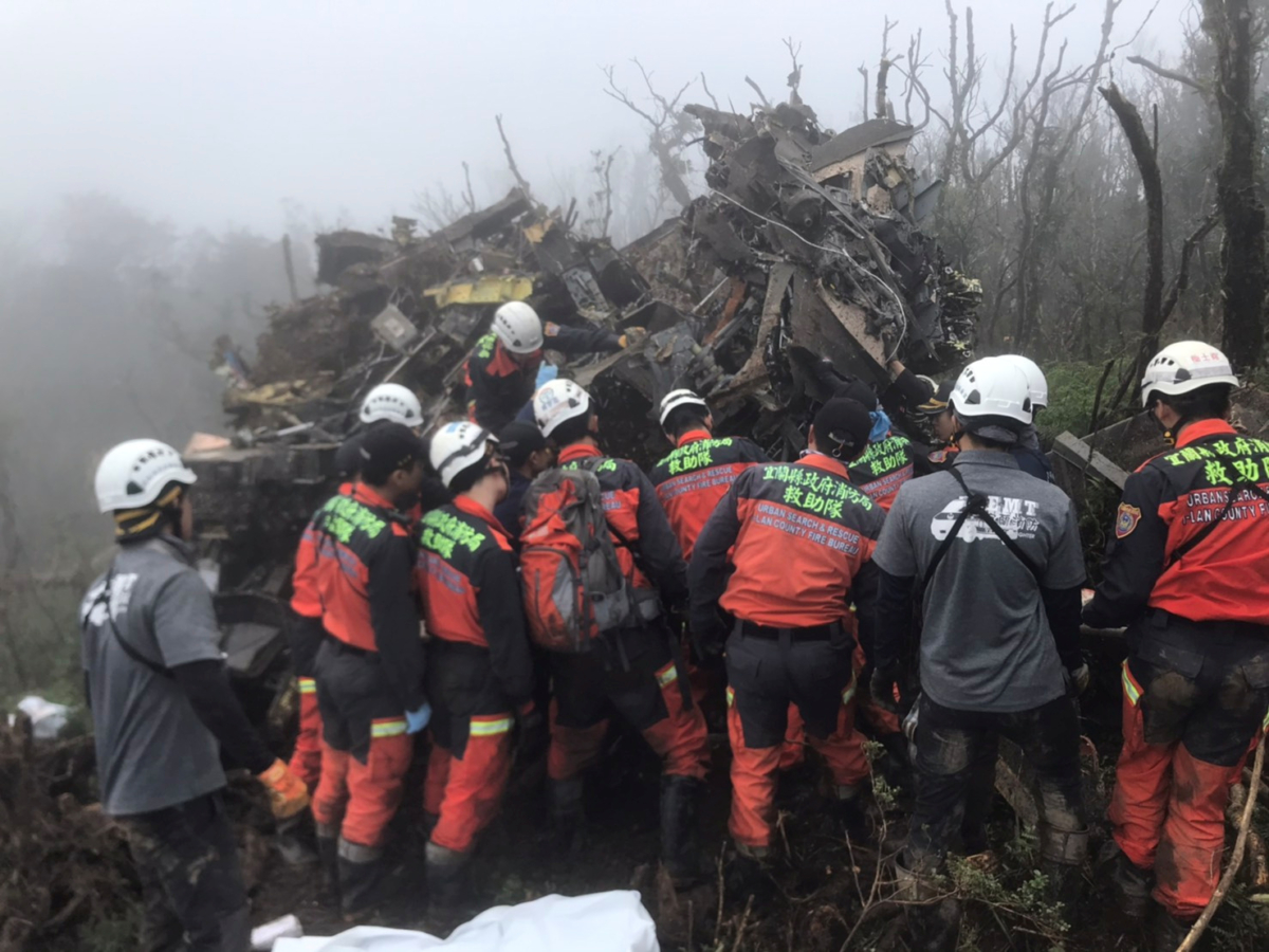 A rescue team searches for missing military officers, after a Black Hawk helicopter made a forced landing at a mountainous area near Taipei, Taiwan on Jan. 2, 2020. (Yilan County Fire Bureau/Handout via Reuters)