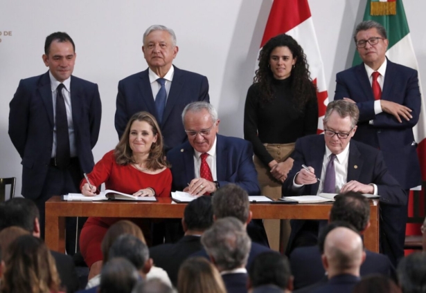 Deputy Prime Minister of Canada Chrystia Freeland, (L), Mexico's top trade negotiator Jesus Seade, (C), and US Trade Representative Robert Lighthizer, sign an update to the North American Free Trade Agreement, at the national palace in Mexico City. Observing from behind are Mexico's Treasury Secretary Arturo Herrera, (L–R), Mexico's President Andres Manuel Lopez Obrador, Mexico's Labor Secretary Maria Alcade, and The President of the Mexican Senate Ricardo Monreal on Tuesday, Dec. 10. 2019. (Marco Ugarte/AP)