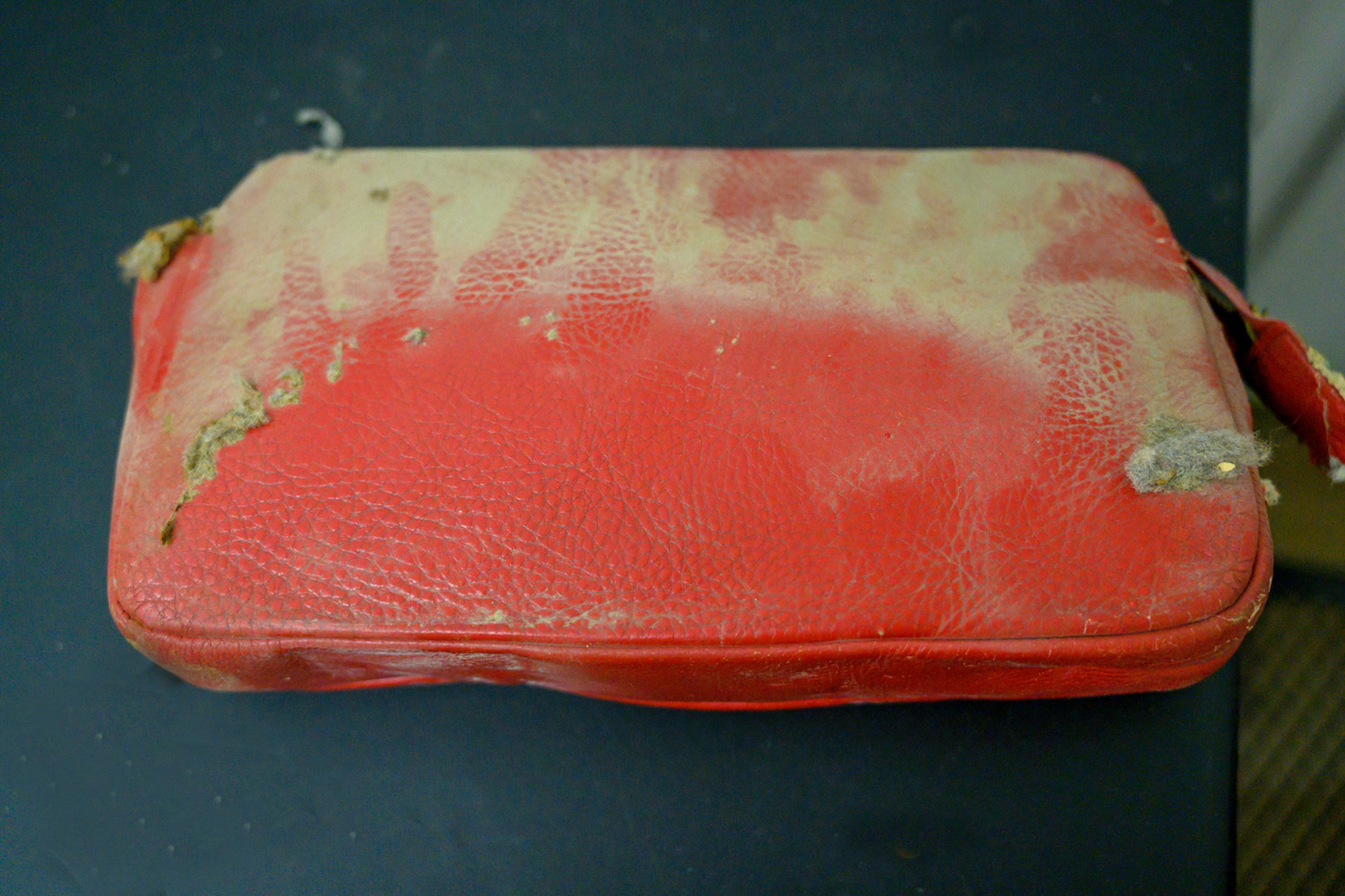 A red purse was discovered between a locker and wall at North Canton Middle School in North Canton, Ohio. (Courtsey of North Canton City Schools)