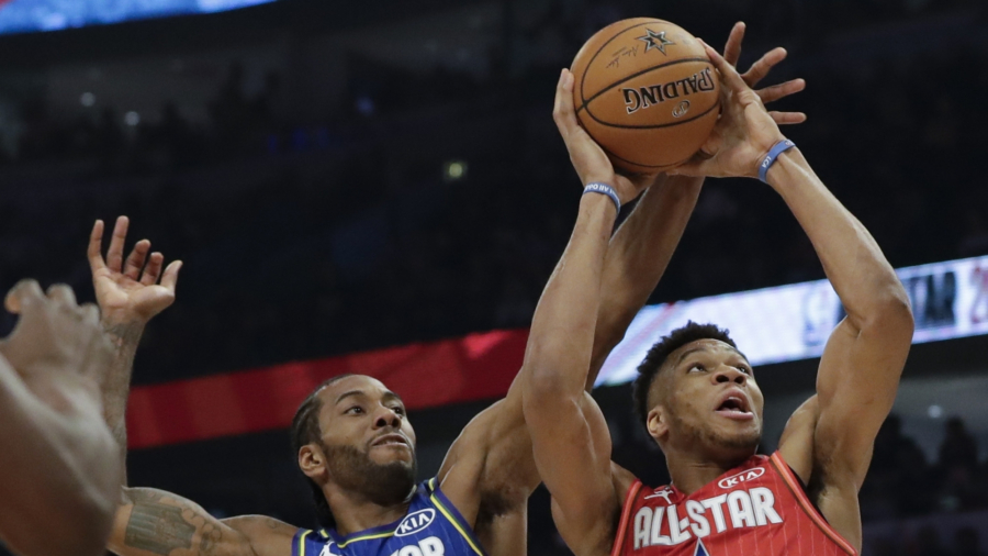Photo: ntd.com Kawhi Leonard of the Los Angeles Clippers blocks a shot of Giannis Antetokounmpo of the Milwaukee Bucks during the second