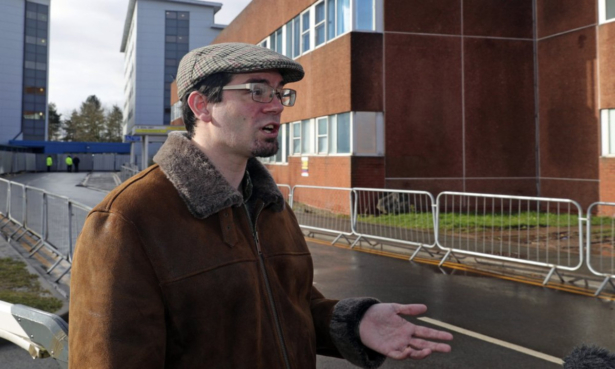 Matt Raw, a British national who returned from the coronavirus-hit city of Wuhan in China, speaks to the media outside Arrowe Park Hospital where he spent two weeks in quarantine, in Wirral, England, on Feb. 13, 2020. (Peter Byrne/PA via AP)