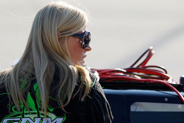 Candace Muzny looks on from the grid during qualifying for the NASCAR K&N Pro Series East Dover 150 at Dover International Speedway in Dover, Delaware, on Sept. 30, 2011. (Jerry Markland/NASCAR/Getty Images)