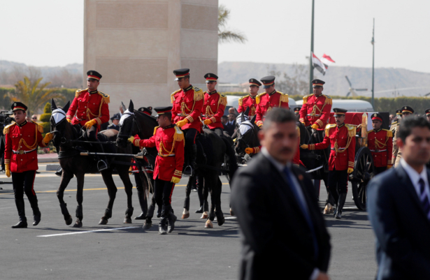 The coffin of former Egyptian President Hosni Mubarak is carried on a horse-drawn hearse during his funeral, east of Cairo, Egypt, on Feb. 26, 2020. (Amr Abdallah Dalsh/Reuters)