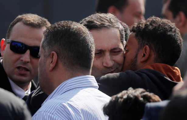 Alaa, son of former Egyptian President Hosni Mubarak, is kissed as he is consoled during his father's funeral east of Cairo, Egypt, on Feb. 26, 2020. (Amr Abdallah Dalsh/ Reuters)