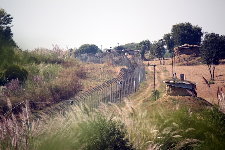 The fence erected within the Indian territory near the India-Pakistan International Border along with floodlights at Chak Changa village at Hiranagar, Jammu State, India, Oct. 2012. (Venus Upadhayaya/The Epoch Times)