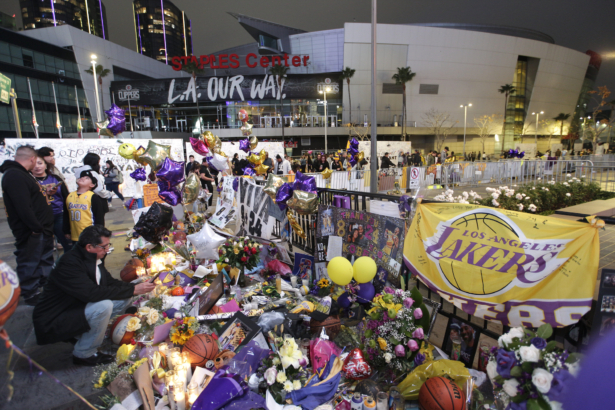 Fans gather at a memorial for Kobe Bryant in front of Staples Center in Los Angeles, on Feb. 2, 2020. (Damian Dovarganes/AP Photo)