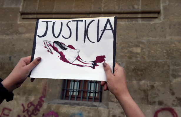Demonstrators gather to protest gender violence outside the National Palace, in Mexico City, Mexico, on Feb. 18, 2020. (Alfredo Estrella/AFP via Getty Images)