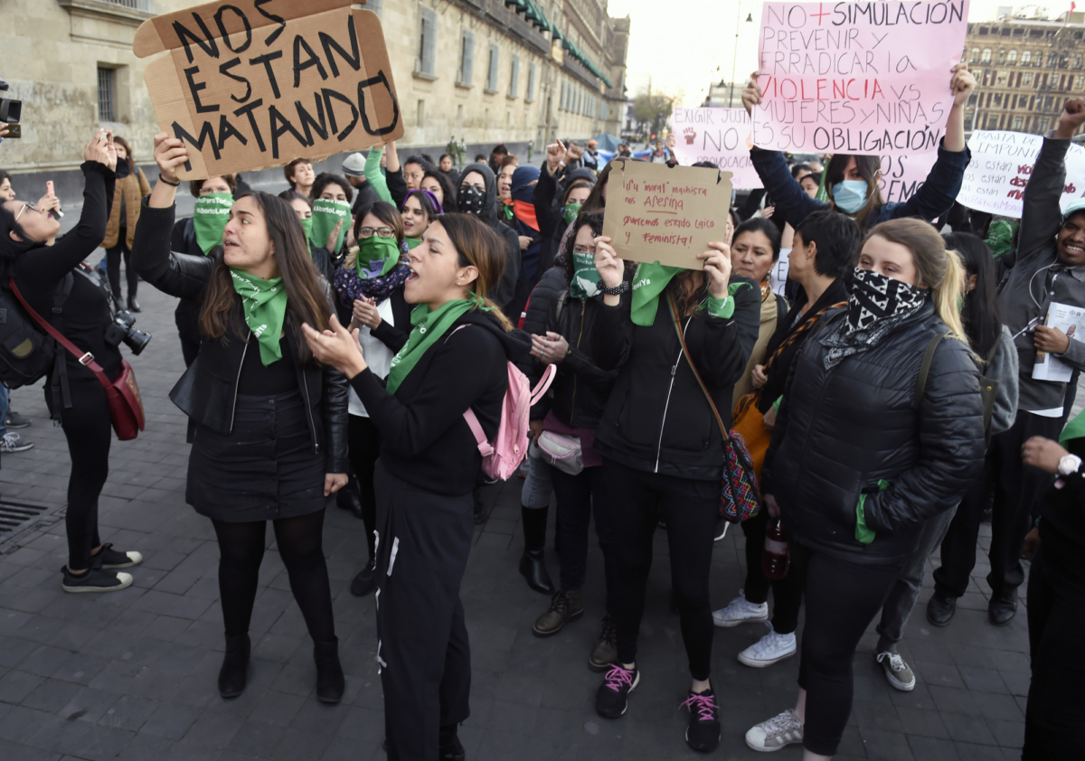 Demonstrators gather to protest gender violence outside the National Palace, in Mexico City, Mexico, on Feb. 18, 2020. (Alfredo Estrella/AFP via Getty Images)