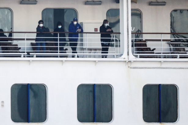 Passengers wearing mask are seen on the cruise ship Diamond Princess, at Daikoku Pier Cruise Terminal in Yokohama, Japan, on Feb. 13, 2020. (Kim Kyung-Hoon/Reuters)