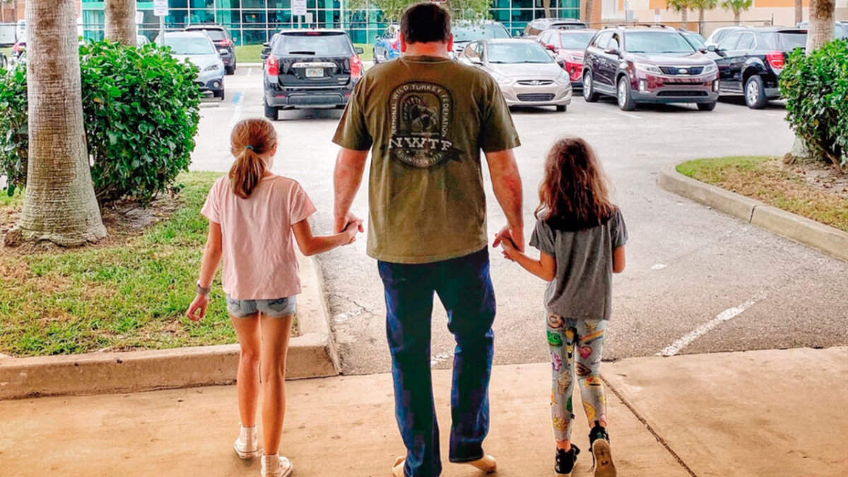 NASCAR driver Ryan Newman and his daughters, Brooklyn Sage (L) and Ashlyn Olivia, leave Halifax Medical Center in Daytona Beach, Fla., on Feb. 19, 2020. (Roush Racing via AP)
