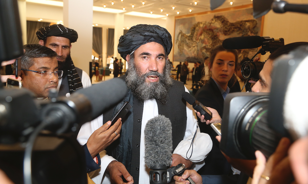 Taliban leader Mullah Abdul Salam Zaeef, who served as ambassador to Pakistan during the Taliban's rule speaks to the media in Doha, Qatar, on Feb. 29, 2020. (AP Photo/Hussein Sayed)