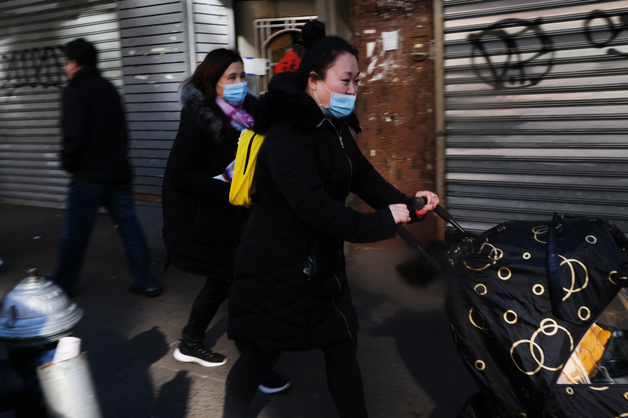 People wear medical face masks on the streets of Chinatown in New York City on Jan. 29, 2020. (Spencer Platt/Getty Images)
