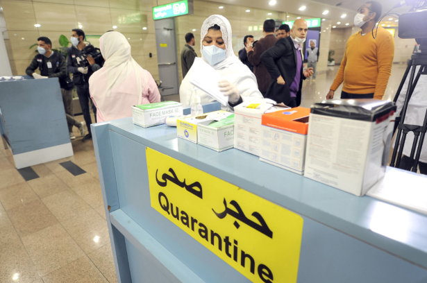 Egyptian Quarantine Authority employees prepare to scan body temperature for incoming travellers at Cairo International Airport on Feb. 1, 2020. (AFP via Getty Images)