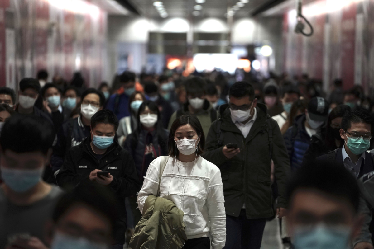 People wearing masks in a subway station in Hong Kong on Feb. 7, 2020. (Kin Cheung/AP Photo)