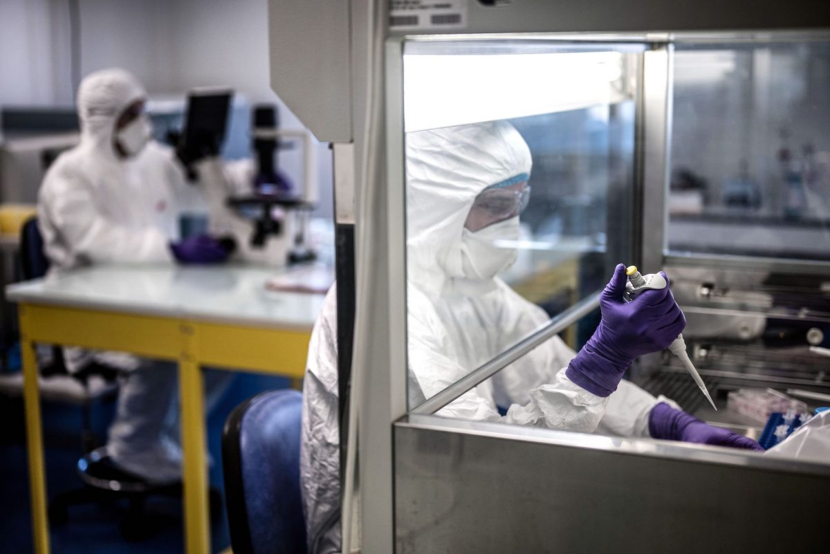 Scientists are at work in the VirPath university laboratory, classified as "P3" level of safety as they try to find an effective treatment against the new SARS-like coronavirus, on February 5, 2020. (Jeff Pachoud/AFP via Getty Images)