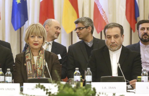 The European Union's political director Helga Schmid (L) and Iran's deputy Foreign Minister Abbas Araghchi wait for a bilateral meeting as part of the closed-door nuclear talks with Iran in Vienna, Austria, on Feb. 26, 2020. (Roland Zak/AP Photo)