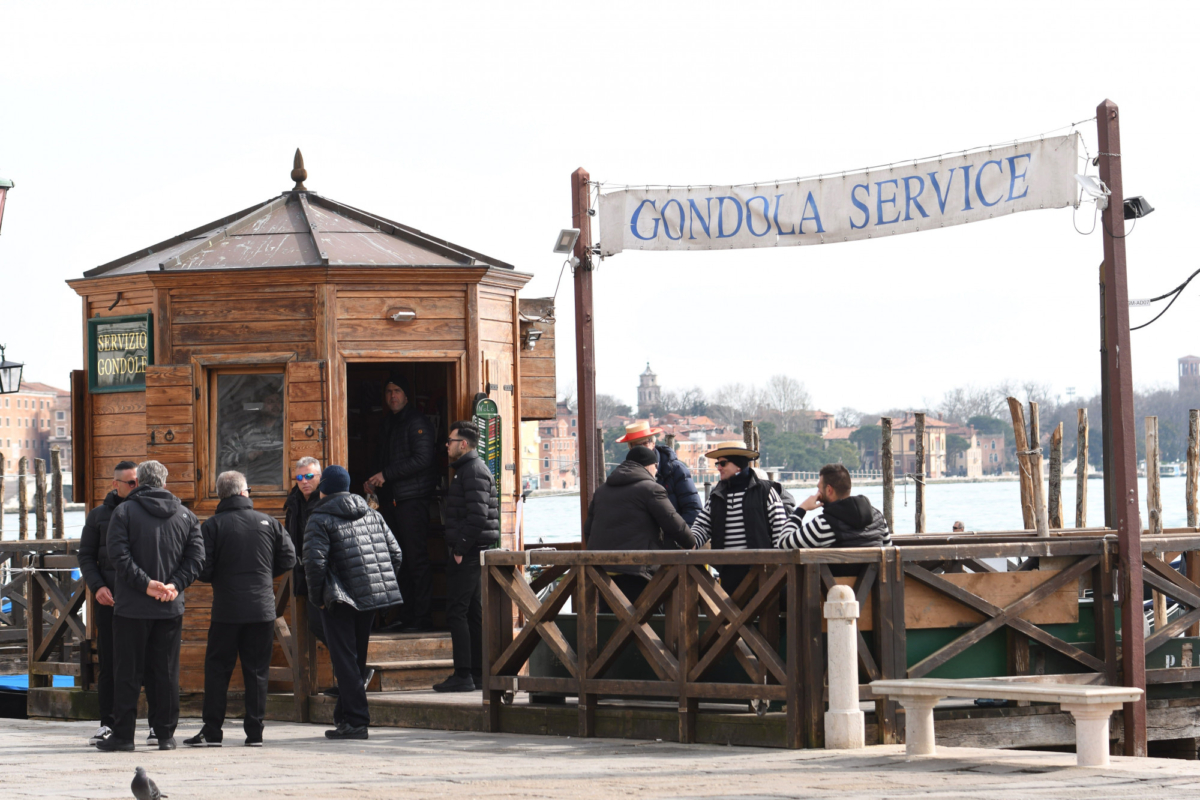 Gondolieri wait for tourists in Riva degli Schiavoni in Venice, Italy, on March 5, 2020. (Andrea Pattaro/AFP via Getty Images)