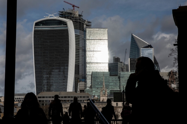 Members of the public walk past the city of London skyline in London, England, on March 4, 2019. (Dan Kitwood/Getty Images)