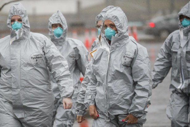 Medical personnel arrive to perform COVID-19 coronavirus infection testing procedures at Glen Island Park in New Rochelle, N.Y. on March 13, 2020. (John Minchillo/AP Photo)