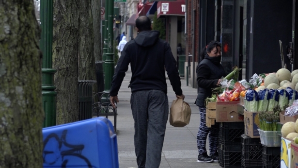 A man walks through downtown New Rochelle in New York on March 12, 2020. (Don Tran/NTD).
