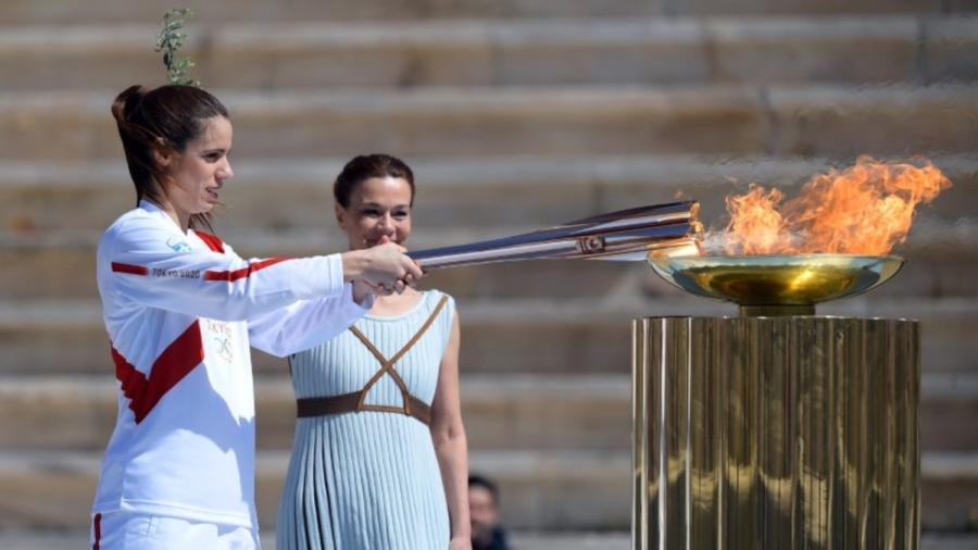 Tokyo 2020 Organizers Receive Olympic Flame for Troubled Games