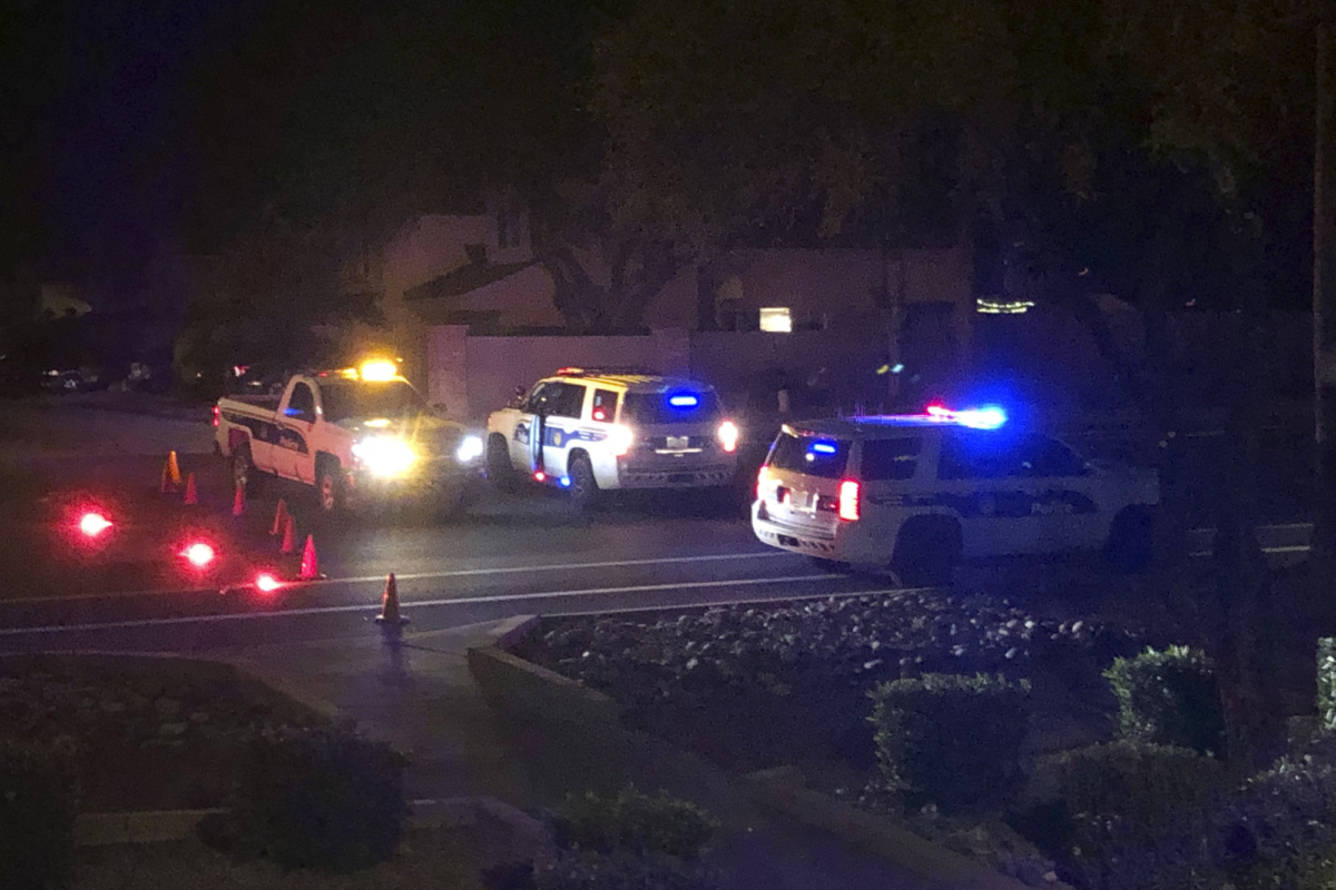 Officers secure a scene of a shooting in Phoenix, Ariz., on Mar. 29, 2020. (Ross Franklin/AP Photo)