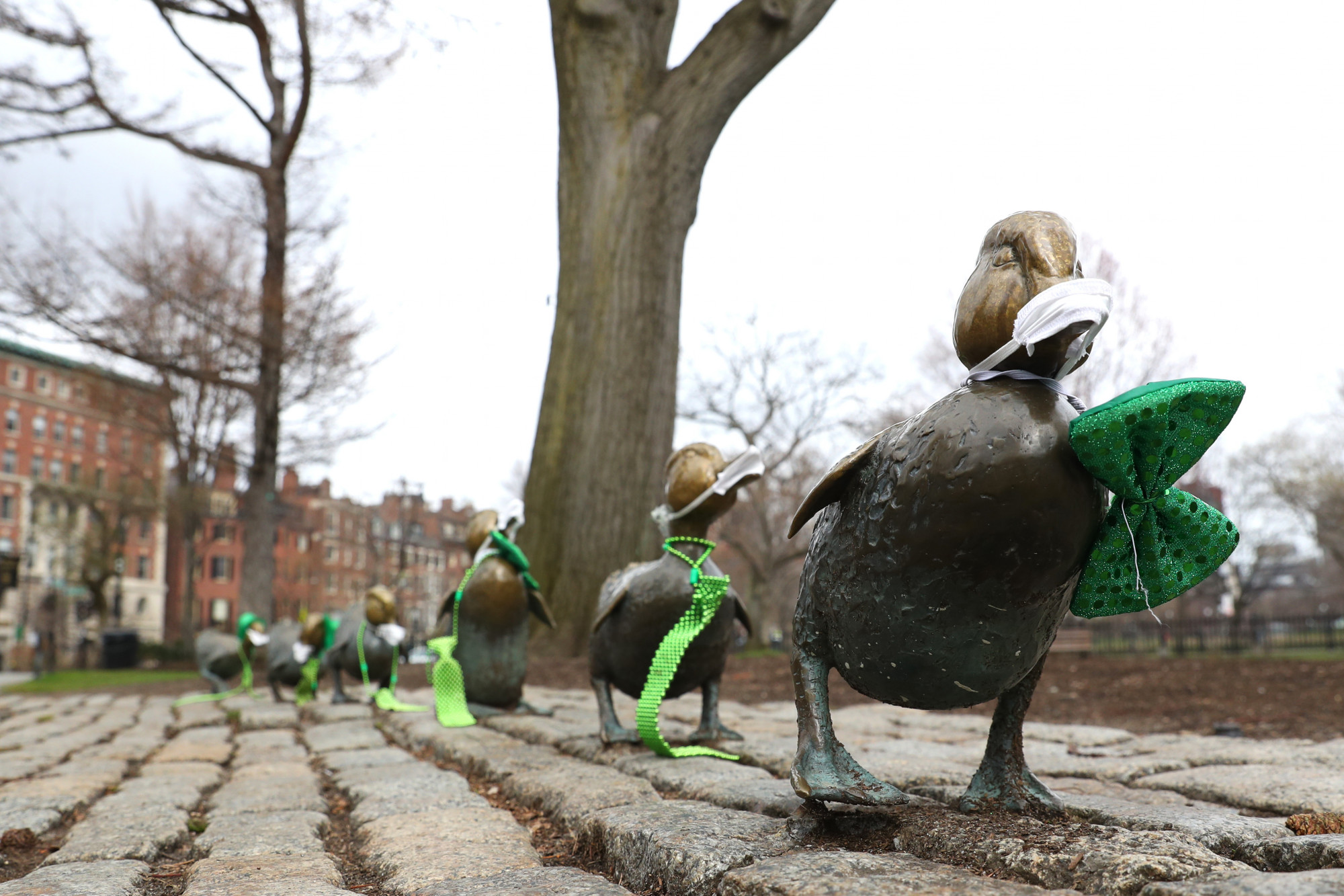 A view of the Make Way for Ducklings statue wearing crafted protective masks in Boston, Mass., on March 25, 2020. (Maddie Meyer/Getty Images)