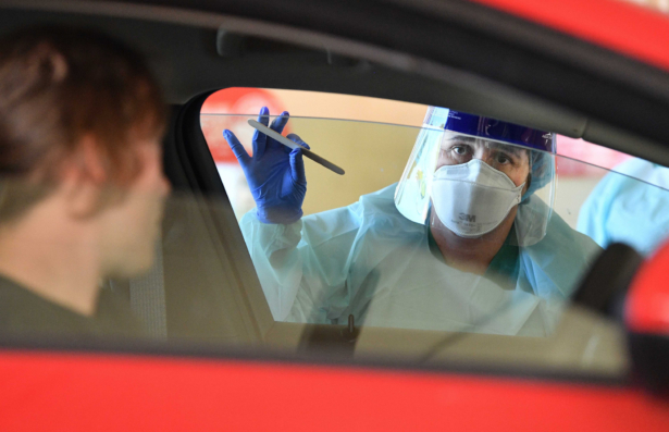 South Australia Hospital staff simulate a drive through coronavirus testing at the Repatriation Hospital in Adelaide, Australia, on March 10, 2020. (AAP Image/David Mariuz)