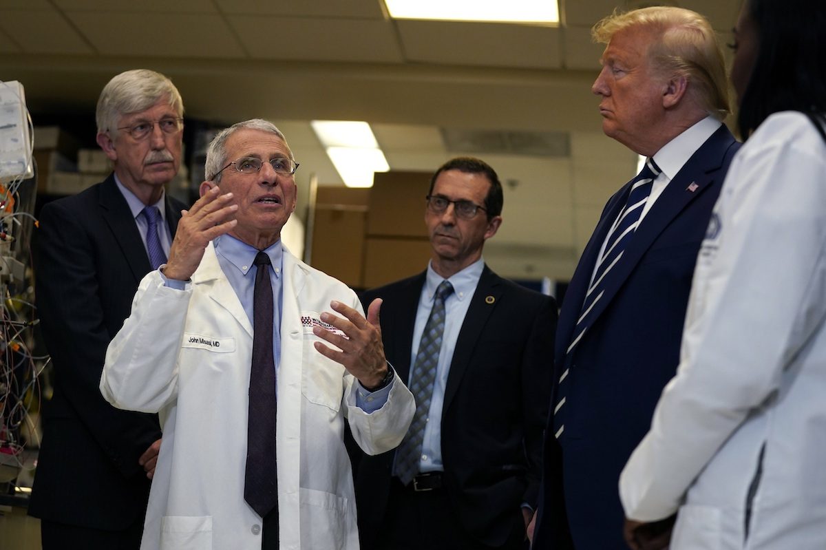 President Donald Trump listens as he tours the Viral Pathogenesis Laboratory at the National Institutes of Health, in Bethesda, Md., on March 3, 2020. (Evan Vucci/AP Photo)