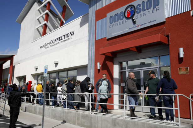 People wait in line for help with unemployment benefits at the One-Stop Career Center in Las Vegas, Nev., on March 17, 2020. (John Locher/AP Photo)