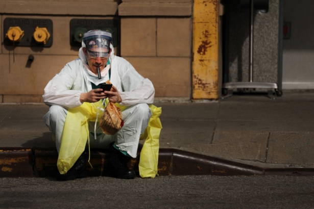 A medical worker takes a break at a special CCP virus intake area at Maimonides Medical Center in the Borough Park neighborhood of the Brooklyn borough of New York City, on April 7, 2020. (Spencer Platt/Getty Images)