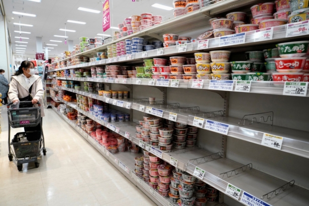 A shopper, wearing a protective mask, looks at shelves at a supermarket, following the outbreak of coronavirus disease (COVID-19), in Tokyo, Japan, on April 7, 2020. (Naoki Ogura/Reuters)