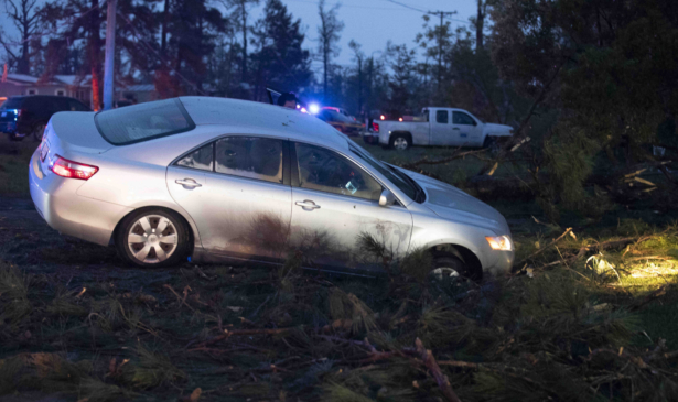A car is seen in a ditch in Onalaska, Texas, after a tornado touched down in the area on April 22, 2020. (Jason Fochtman/Houston Chronicle via AP)