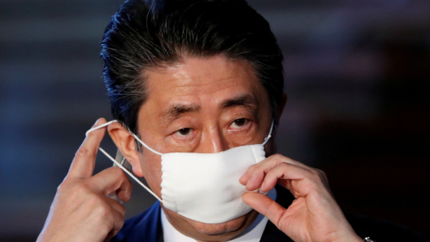 Japan's Prime Minister Shinzo Abe adjusts his face mask as he arrives to speak to the media on Japan's response to the CCP virus outbreak, at his official residence in Tokyo, Japan on April 6, 2020. (Issei Kato/Reuters)