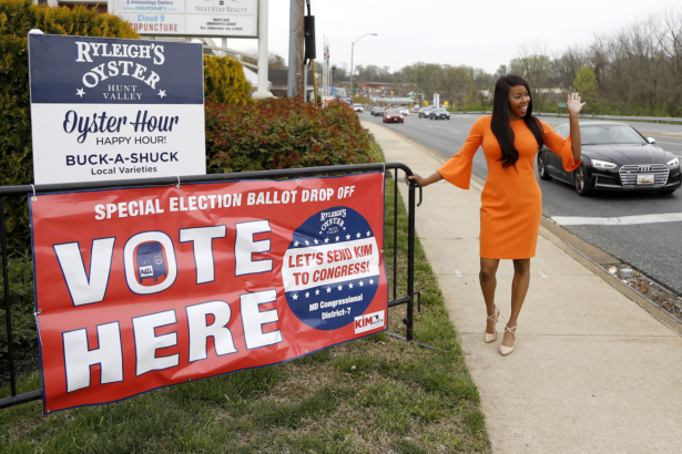 Kimberly Klacik, who is the Republican 7th Congressional District candidate, waves for a supporter in Timonium, Md., on April 21, 2020. (AP Photo/Julio Cortez)