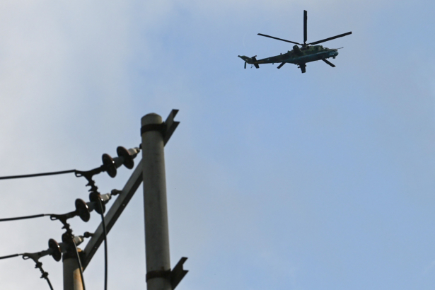A Burma Air Force Mi-35 flying over Lashio in Shan State on Aug. 25, 2019. (Ye Aung Thu/AFP via Getty Images)