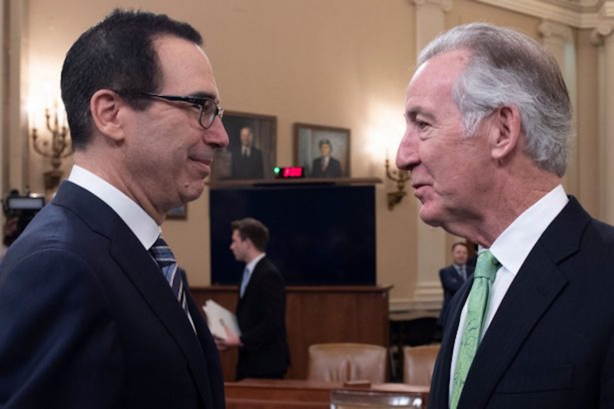 Treasury Secretary Steven Mnuchin (left) speaks with Rep. Richard Neal (D-Mass.), the chairman of the House Ways and Means Committee, prior to testifying on the president’s FY2020 budget proposal before the House Ways and Means Committee, on Capitol Hill, on March 14, 2019. (jim Watson/AFP/Getty Images)